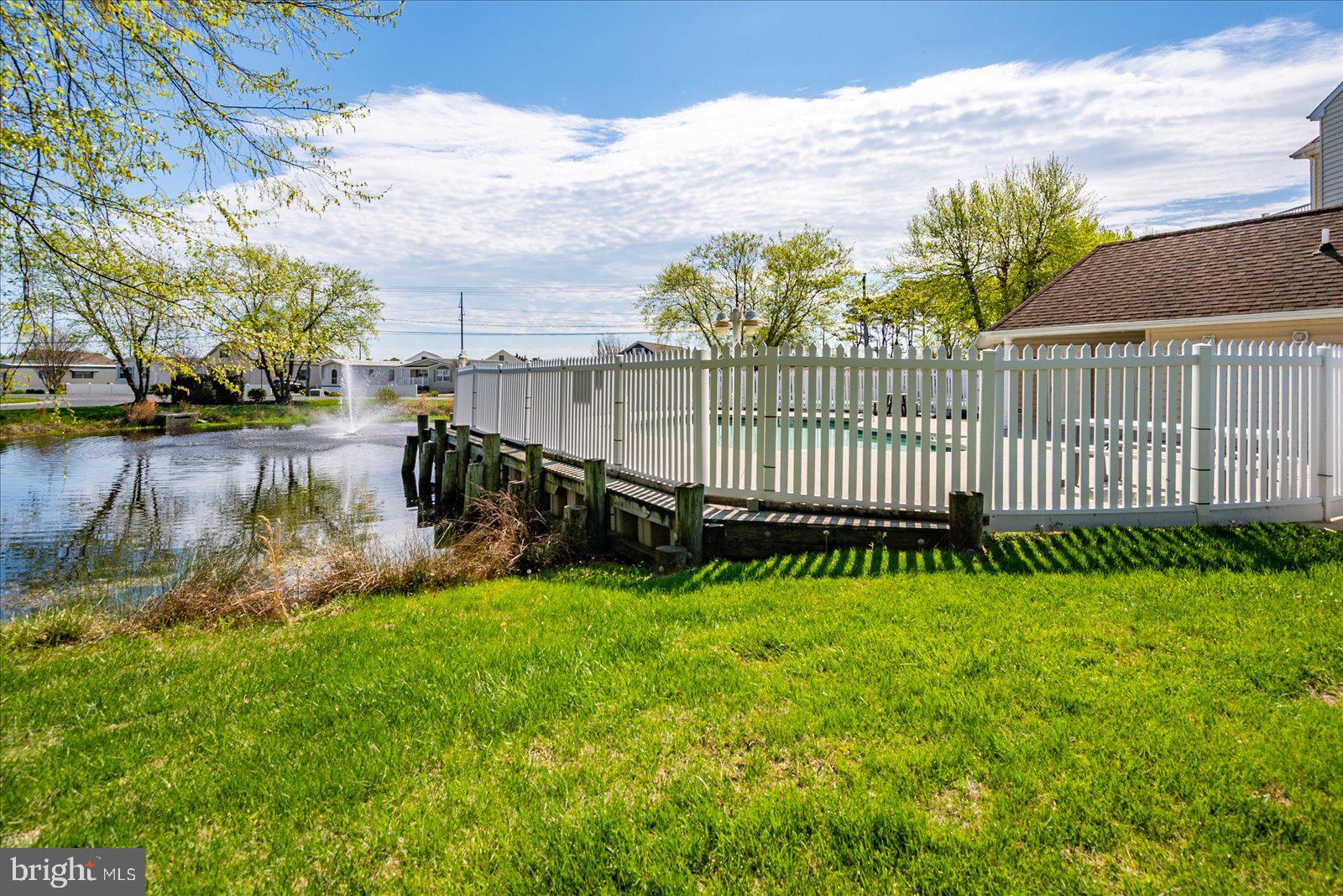 9823 Golf Course Road, Unit 7 Ocean City, MD 21842 - Photo 62 of 76 a view of a backyard with a garden