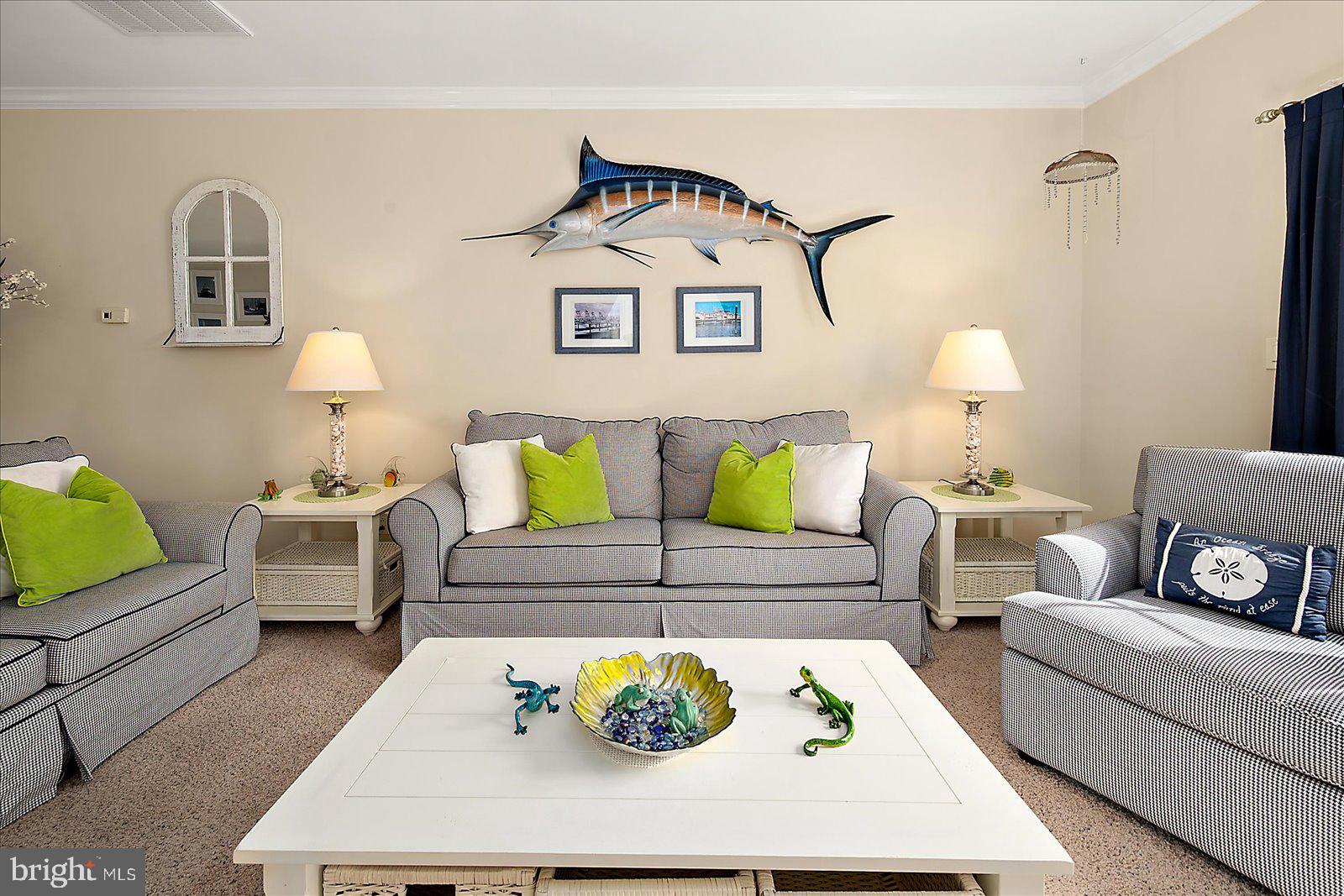 9823 Golf Course Road, Unit 7 Ocean City, MD 21842 - Photo 10 of 76 a living room with furniture and a rug