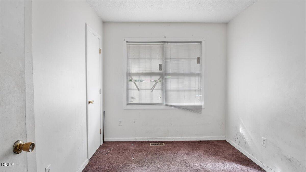 119 Fox Pond Road Henderson, NC 27537 - Photo 11 of 34 an empty room with a window