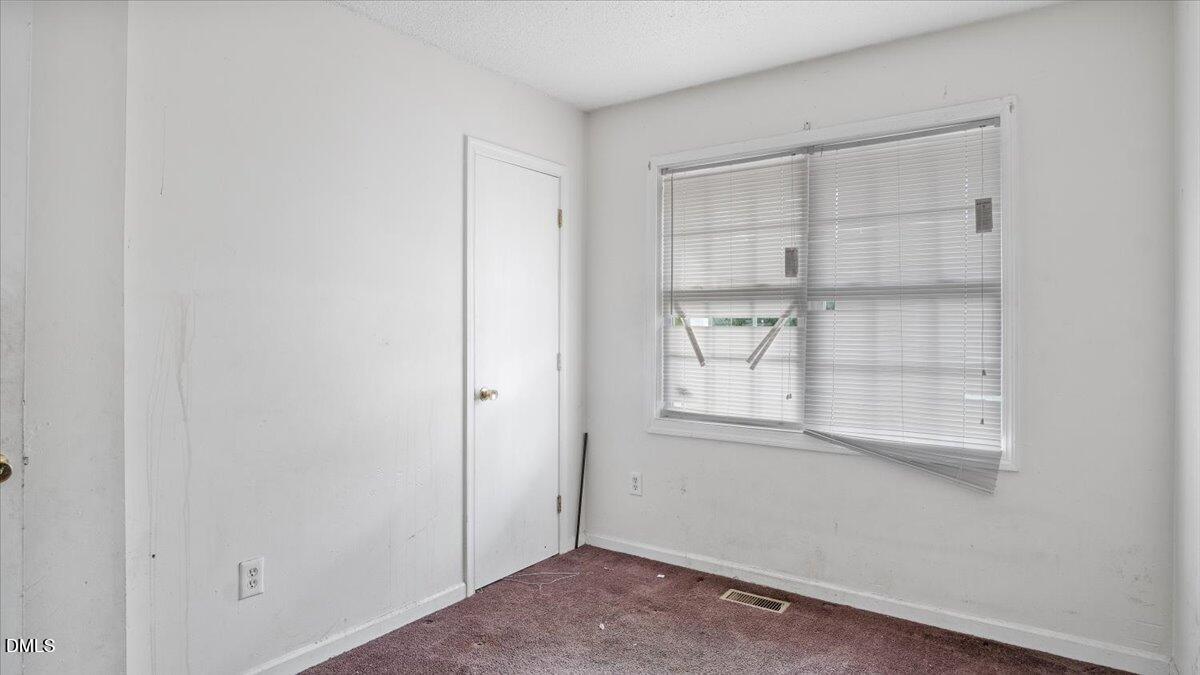 119 Fox Pond Road Henderson, NC 27537 - Photo 12 of 34 a view of a small space with wooden floor and a window