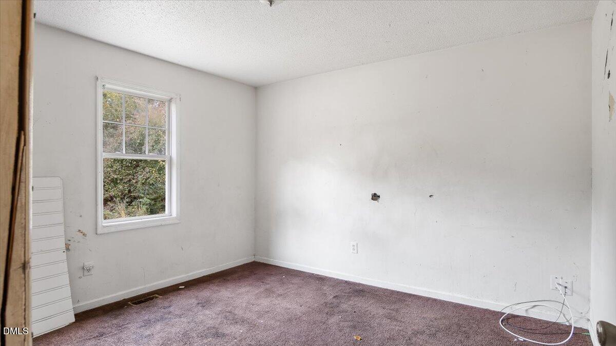 119 Fox Pond Road Henderson, NC 27537 - Photo 15 of 34 an empty room with a window