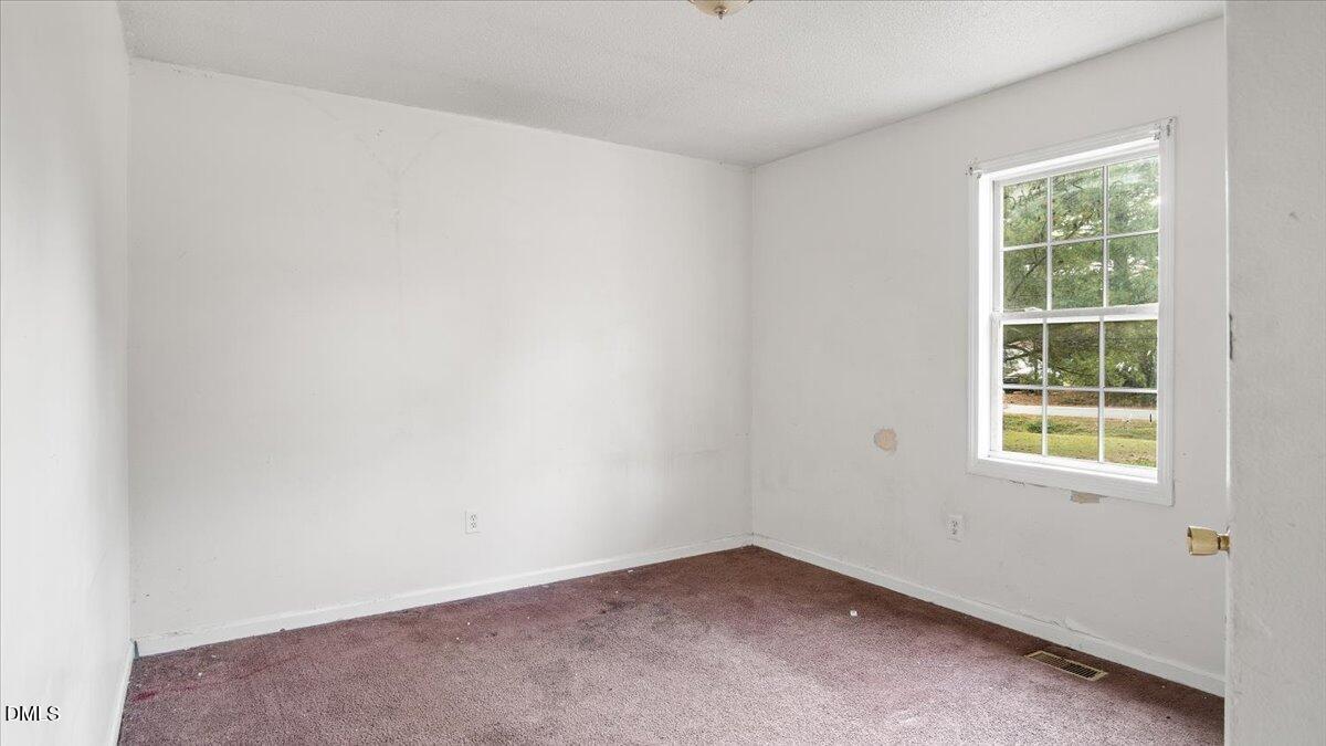 119 Fox Pond Road Henderson, NC 27537 - Photo 18 of 34 an empty room with a window
