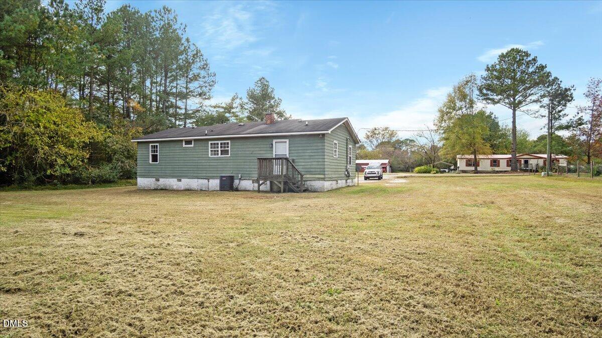 119 Fox Pond Road Henderson, NC 27537 - Photo 25 of 34 a front view of a house with a yard