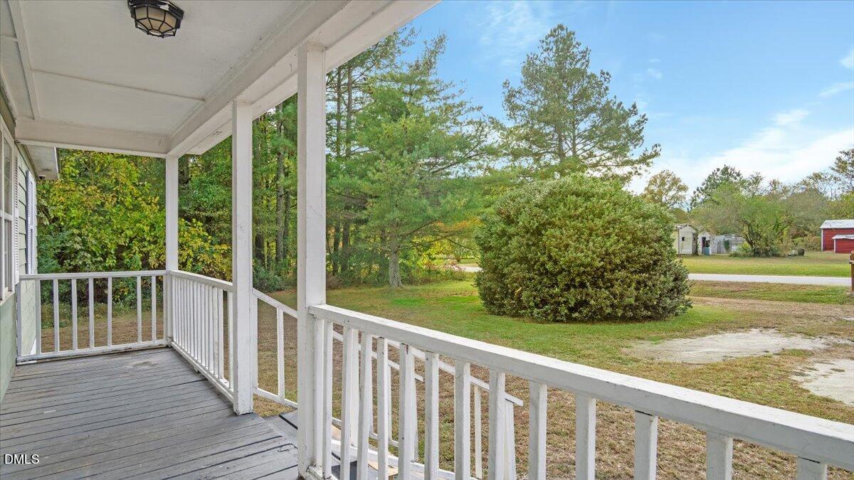 119 Fox Pond Road Henderson, NC 27537 - Photo 5 of 34 a view of a balcony with yard