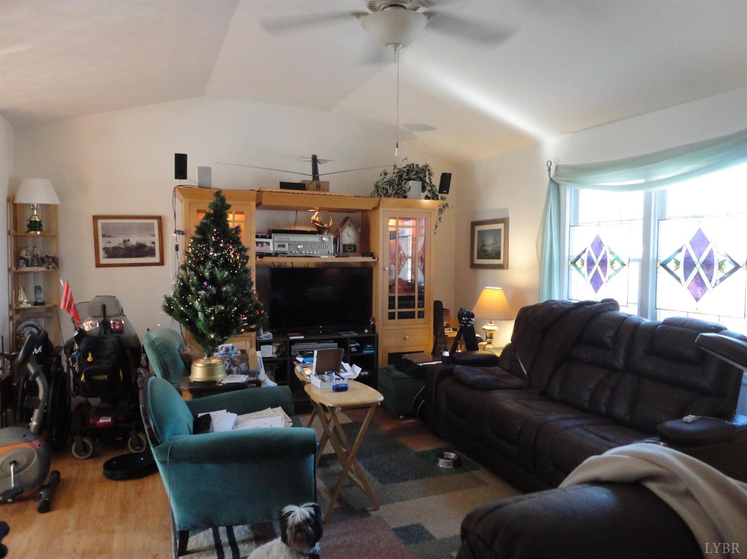617 Phoebe Pond Road Concord, VA 24538 - Photo 3 of 11 a living room with furniture and a flat screen tv