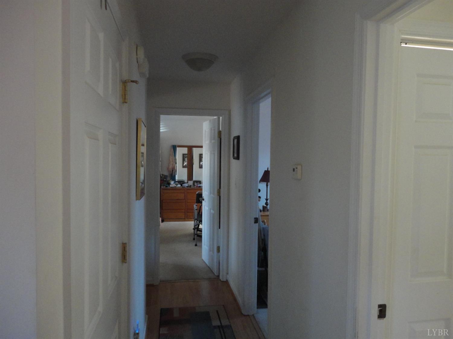 617 Phoebe Pond Road Concord, VA 24538 - Photo 6 of 11 a view of a hallway with a livingroom and furniture
