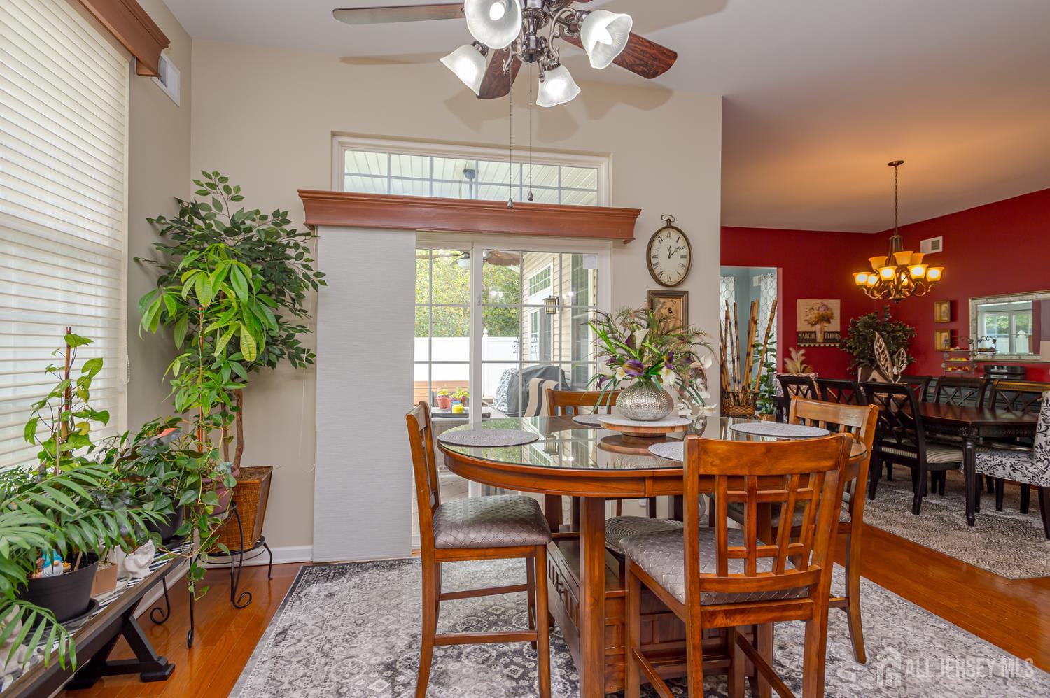 44 Kings Mill Road Monroe Township, NJ 08831 - Photo 11 of 38 a view of a dining room with furniture and chandelier