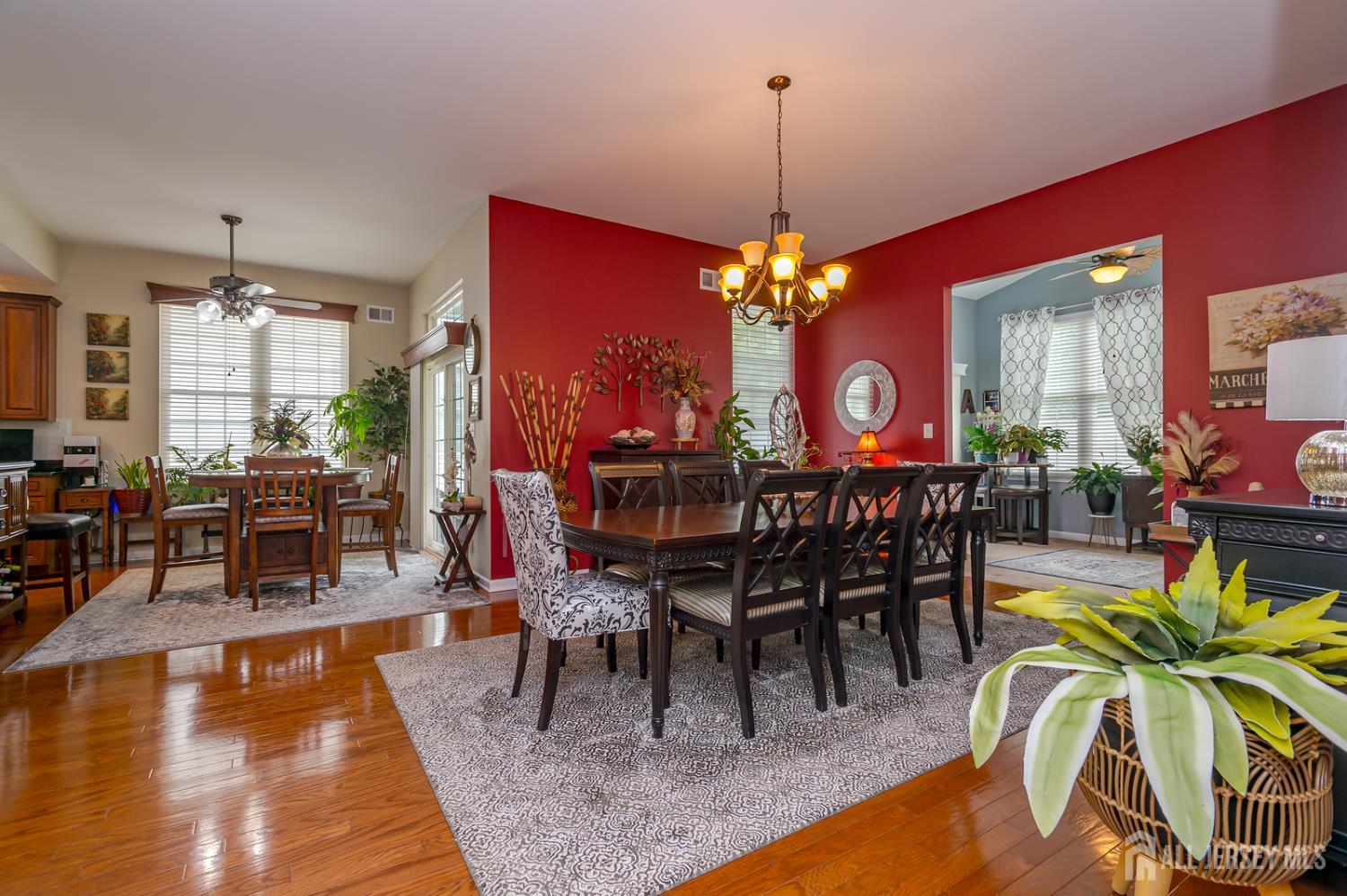 44 Kings Mill Road Monroe Township, NJ 08831 - Photo 15 of 38 a dining room with furniture a rug and a chandelier