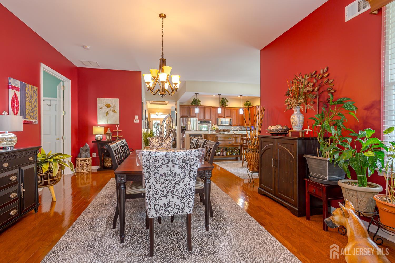 44 Kings Mill Road Monroe Township, NJ 08831 - Photo 17 of 38 a dining room filled with furniture and a chandelier