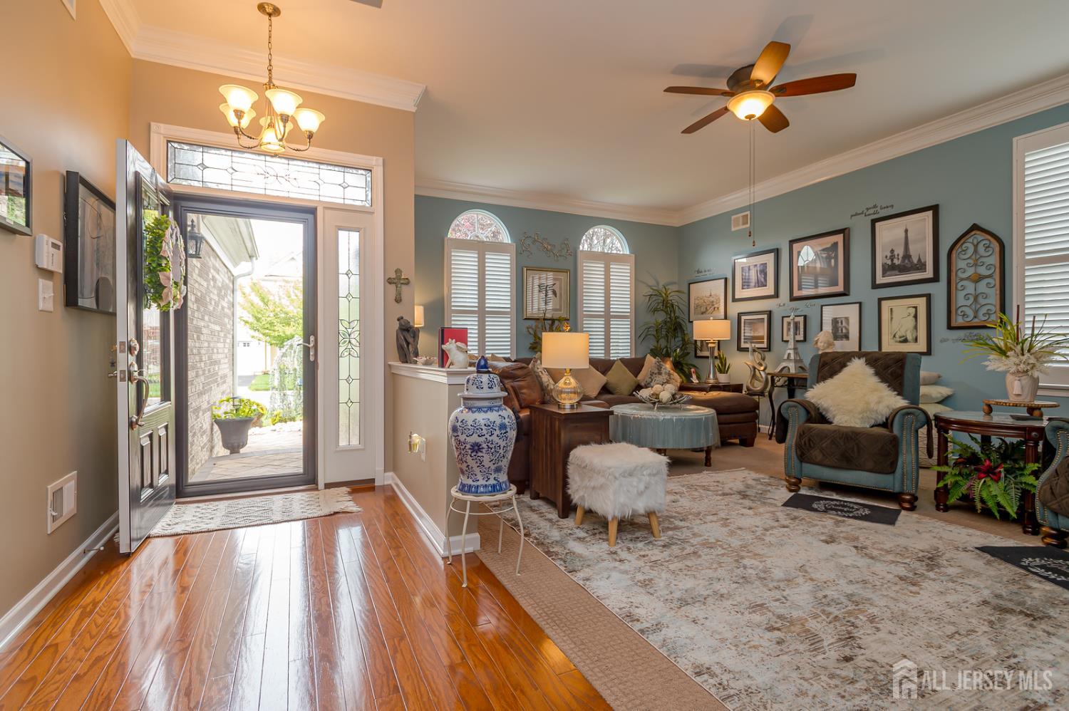 44 Kings Mill Road Monroe Township, NJ 08831 - Photo 5 of 38 a living room with furniture two window and a chandelier