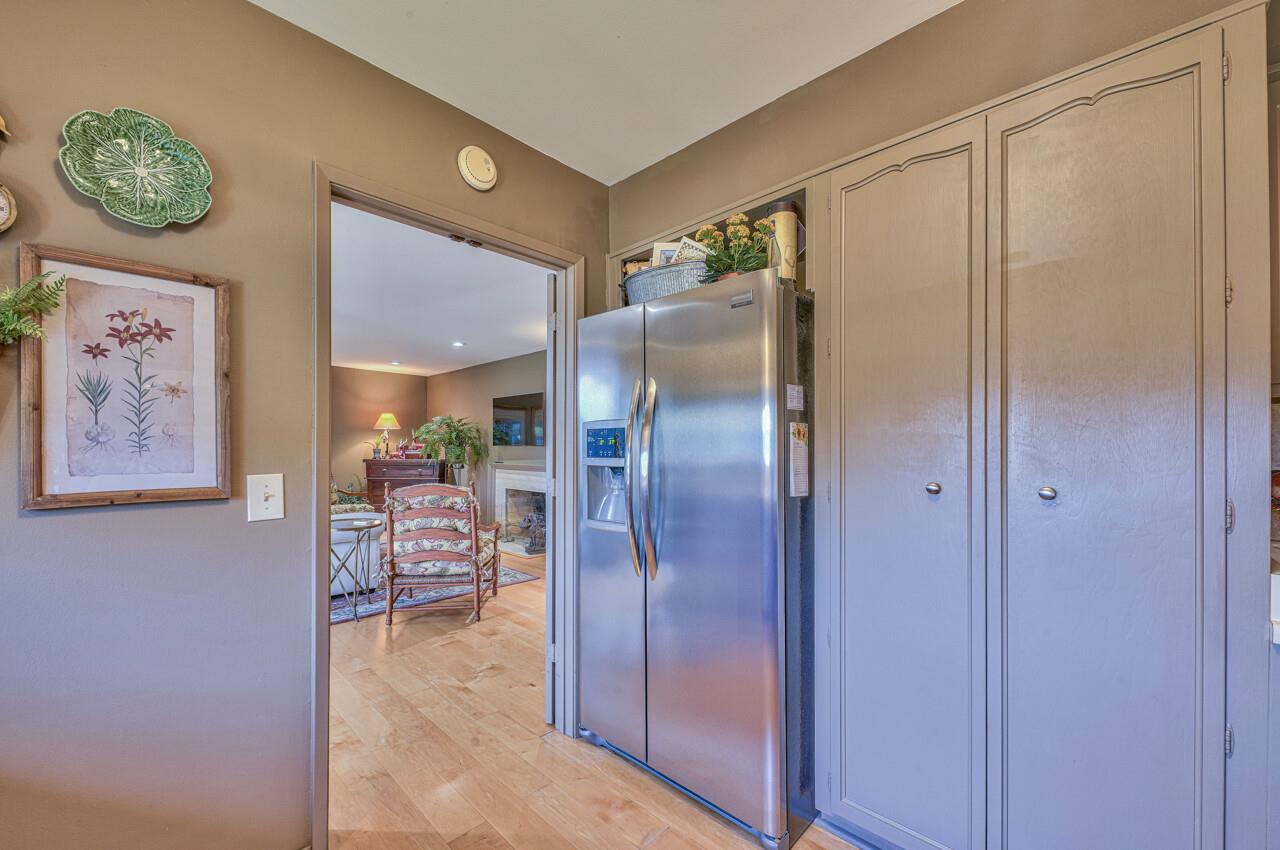 105 Del Mesa Carmel Carmel, CA 93923 - Photo 12 of 35 a view of a refrigerator and a table in a room