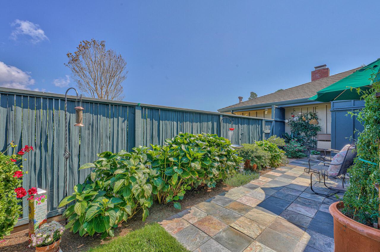 105 Del Mesa Carmel Carmel, CA 93923 - Photo 15 of 35 a garden with flowers in front of it