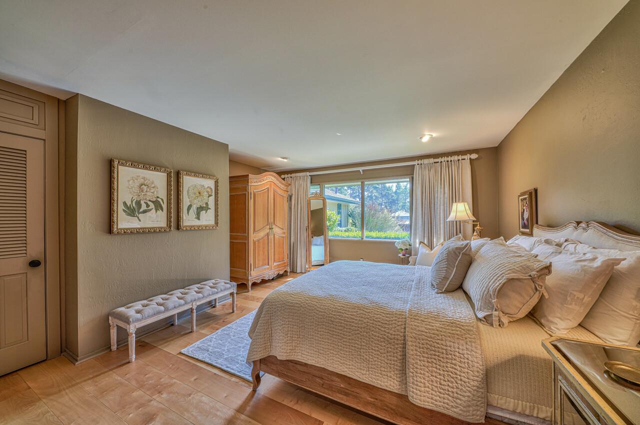 105 Del Mesa Carmel Carmel, CA 93923 - Photo 22 of 35 a bedroom with a bed and a window