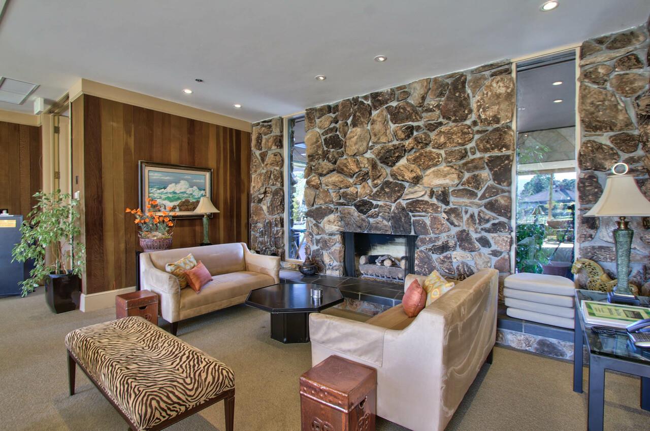 105 Del Mesa Carmel Carmel, CA 93923 - Photo 28 of 35 a living room with furniture and a fireplace