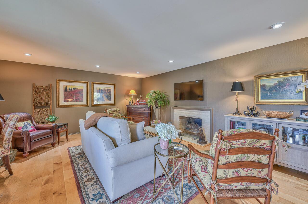 105 Del Mesa Carmel Carmel, CA 93923 - Photo 5 of 35 a living room with fireplace furniture and a flat screen tv