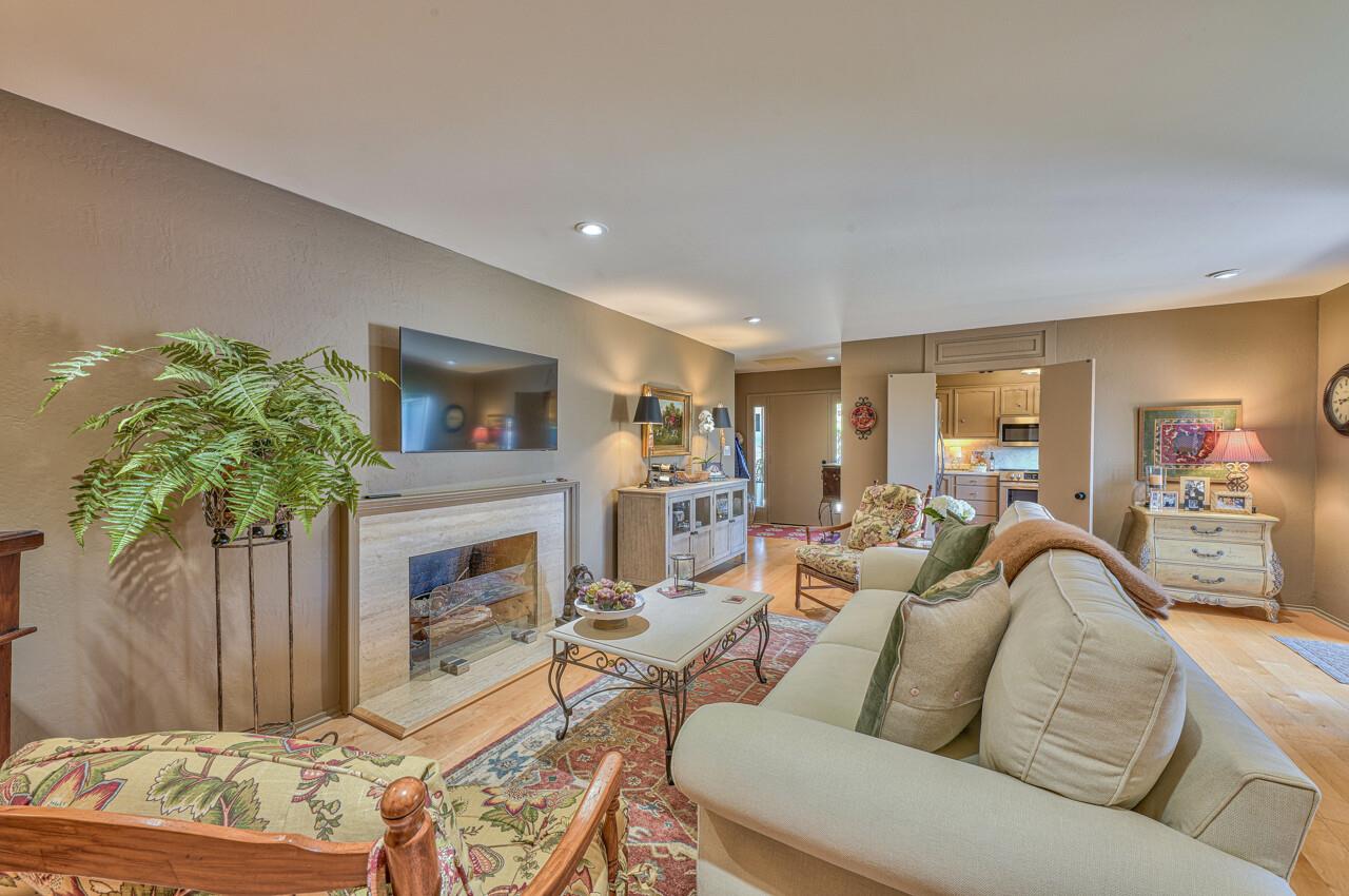 105 Del Mesa Carmel Carmel, CA 93923 - Photo 6 of 35 a living room with furniture and a fireplace