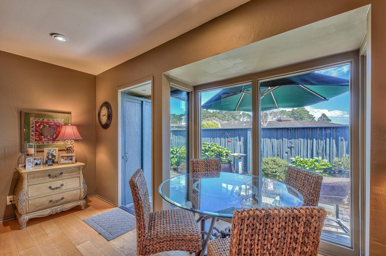 105 Del Mesa Carmel Carmel, CA 93923 - Photo 8 of 35 a view of a dining room with furniture window and wooden floor