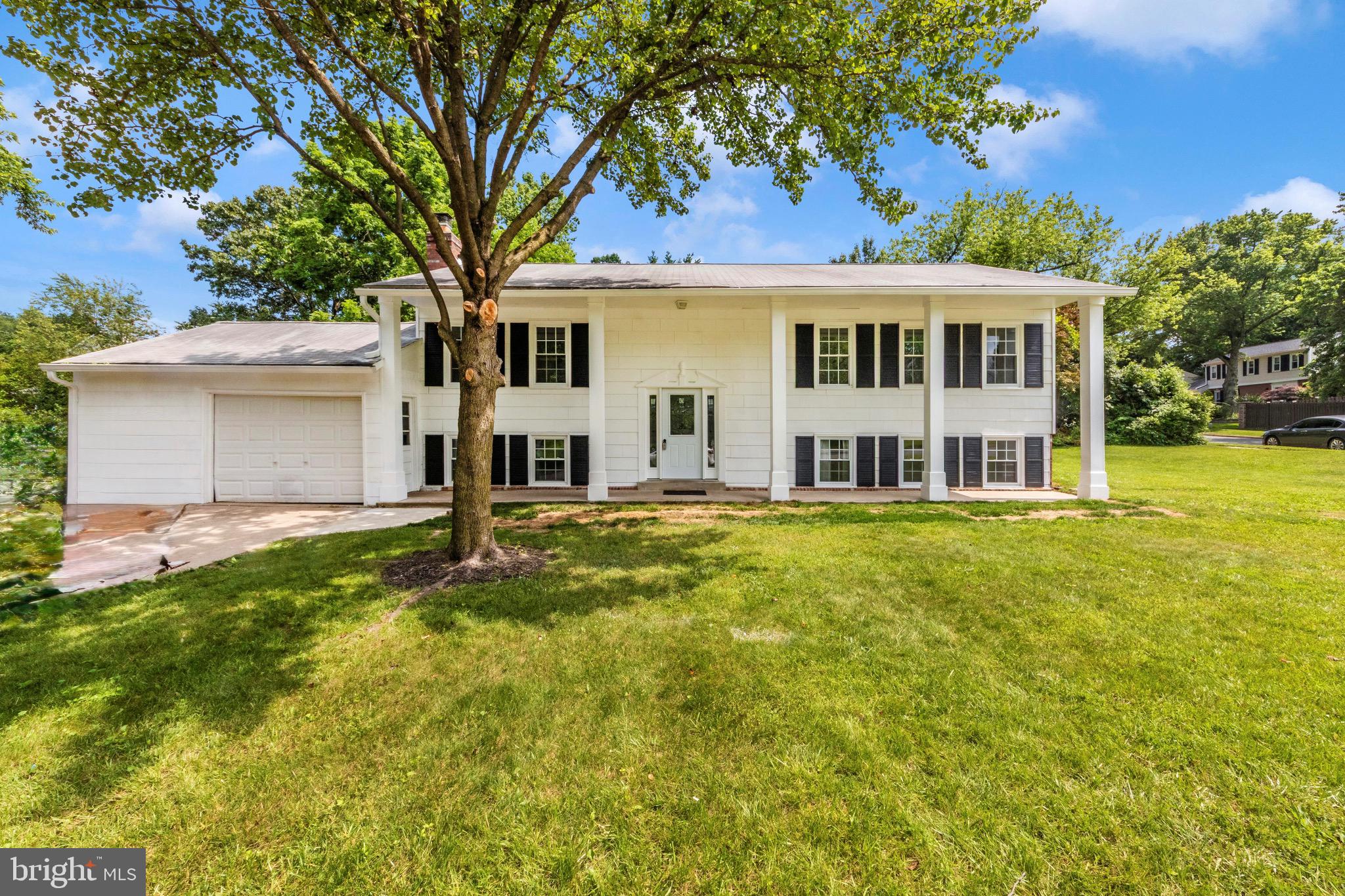 6503 Walker Branch Drive Laurel, MD 20707 - Photo 1 of 36 a front view of a house with a yard