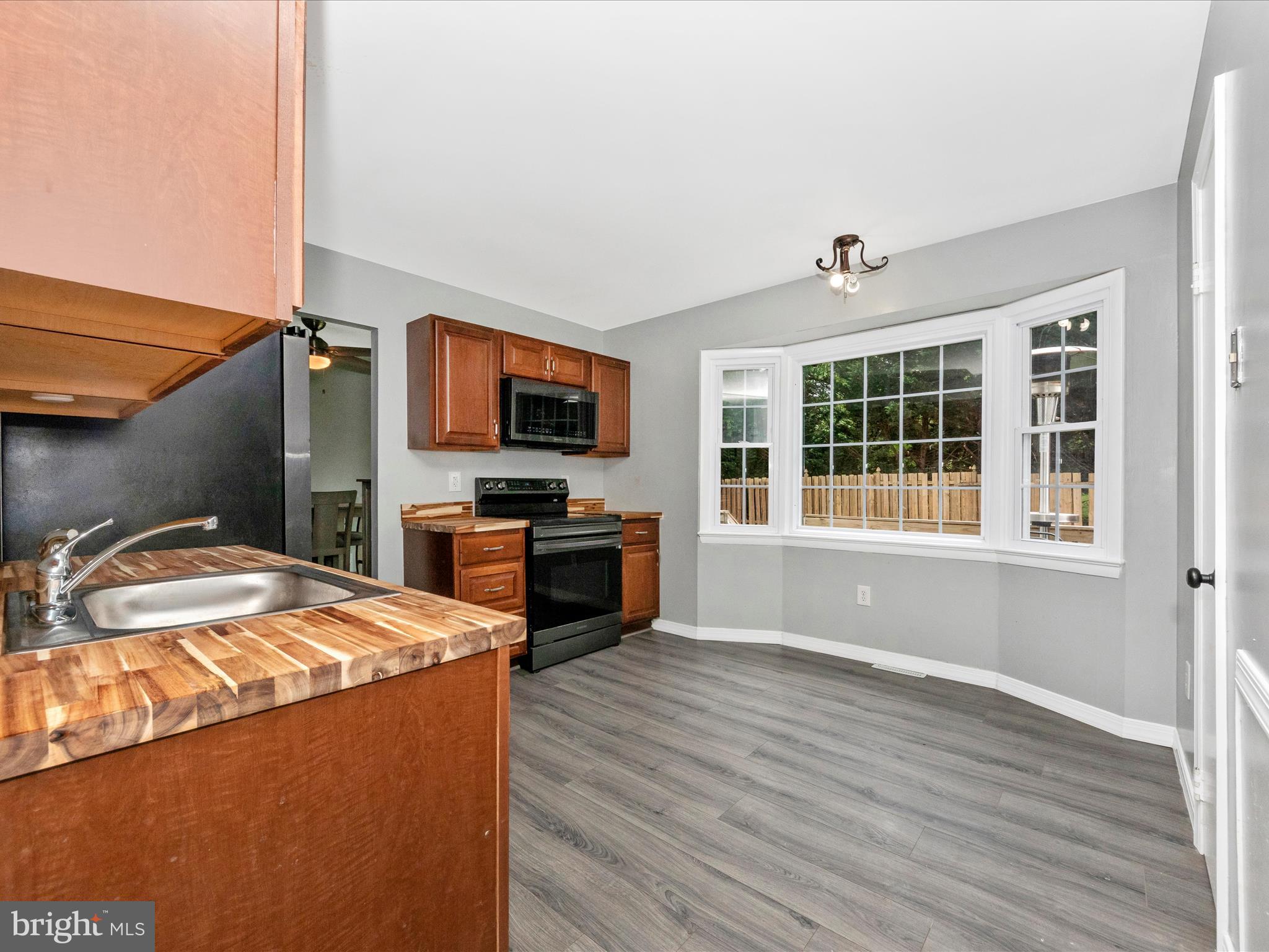6503 Walker Branch Drive Laurel, MD 20707 - Photo 11 of 36 a kitchen with a sink appliances and cabinets