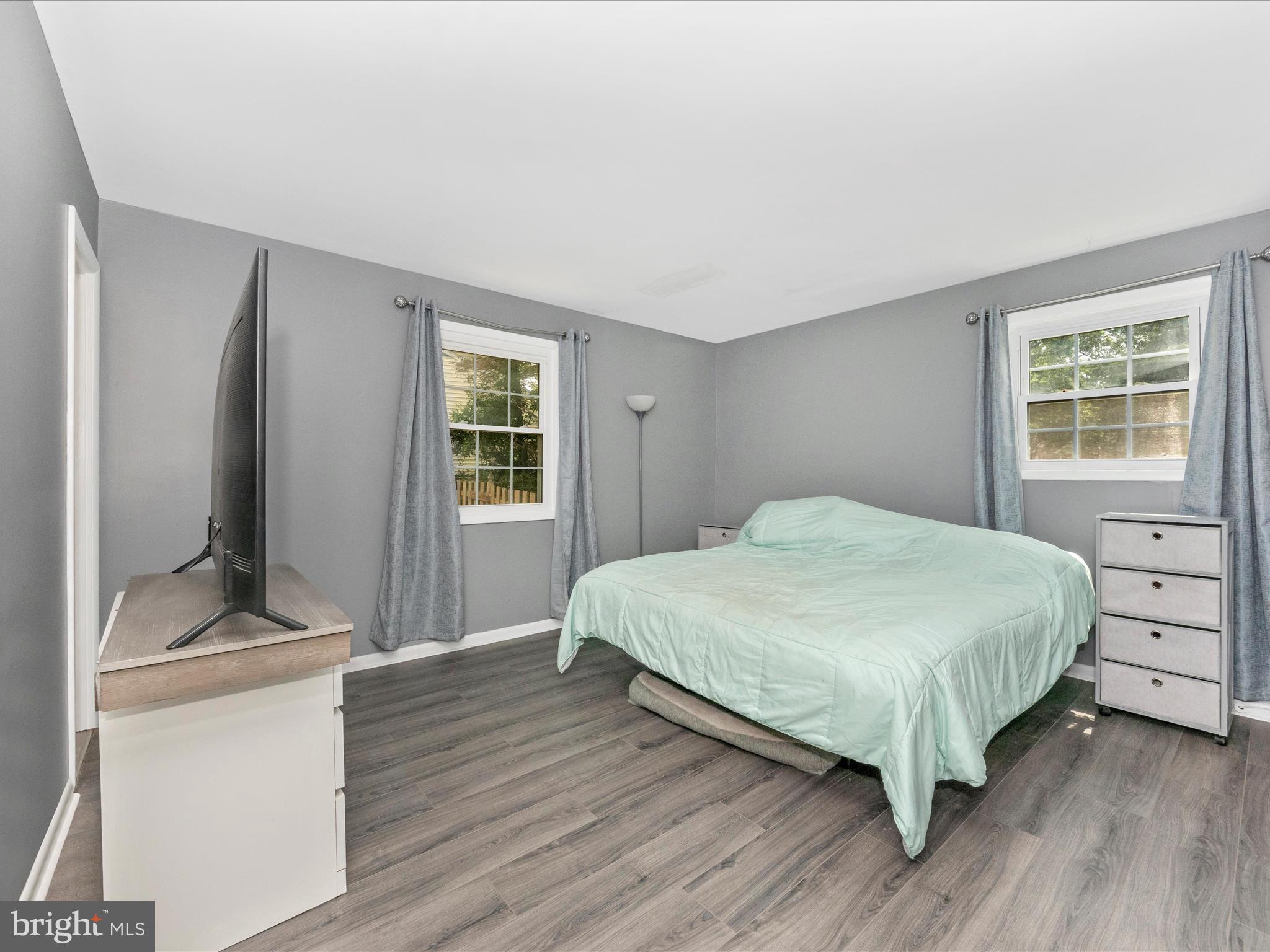 6503 Walker Branch Drive Laurel, MD 20707 - Photo 13 of 36 a bedroom with a bed and a flat screen tv