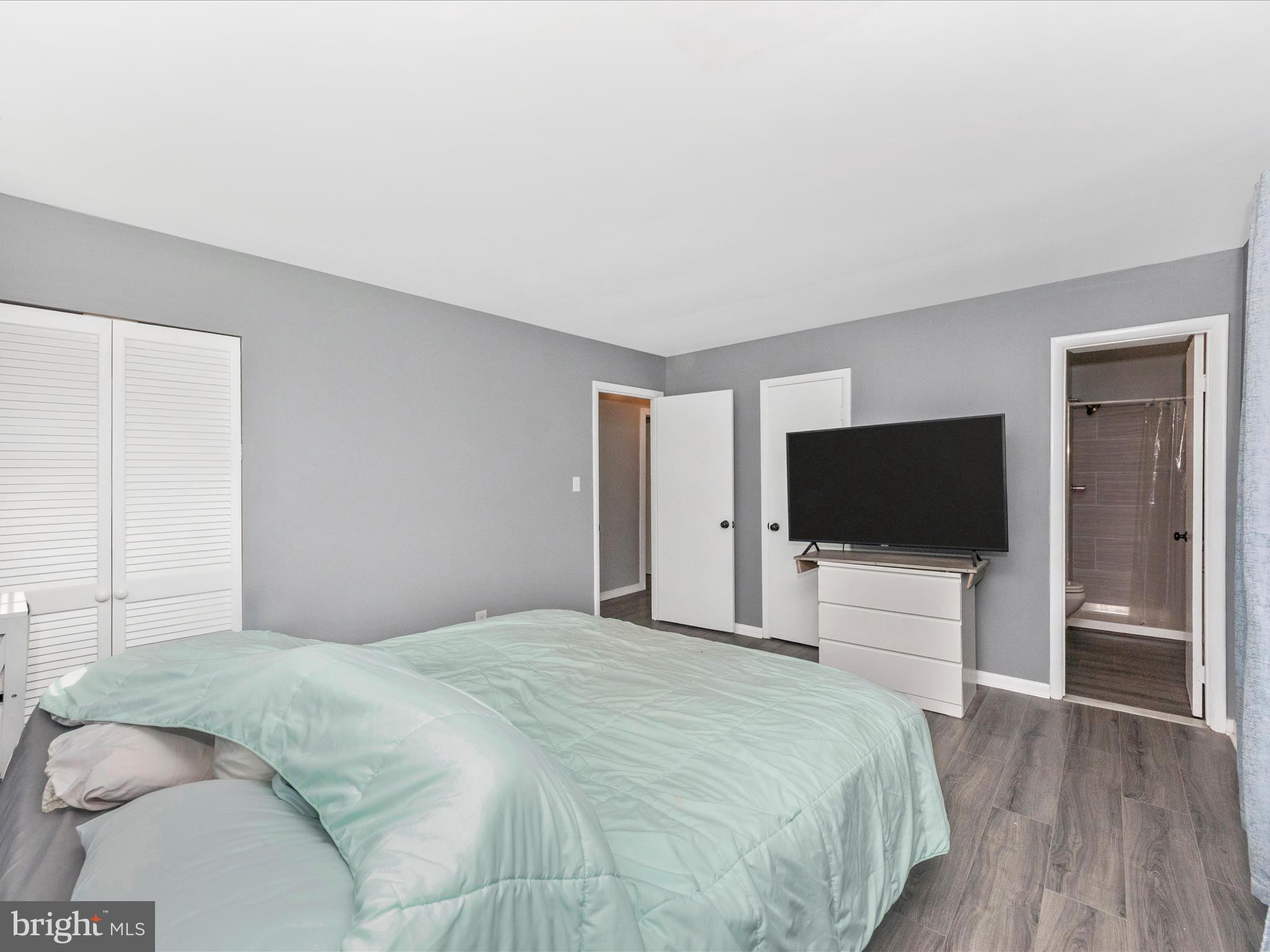 6503 Walker Branch Drive Laurel, MD 20707 - Photo 15 of 36 a bedroom with a bed and a flat screen tv