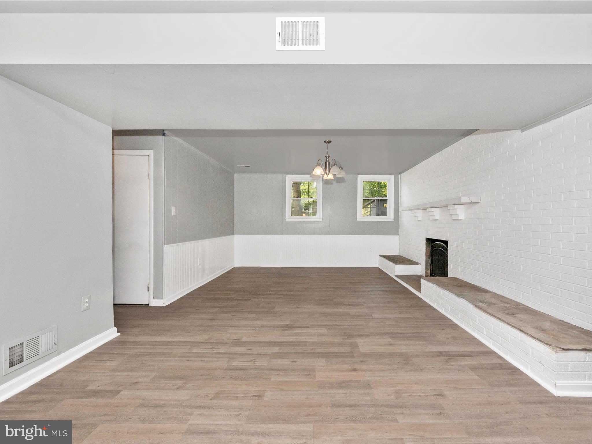6503 Walker Branch Drive Laurel, MD 20707 - Photo 24 of 36 an empty room with windows and fireplace