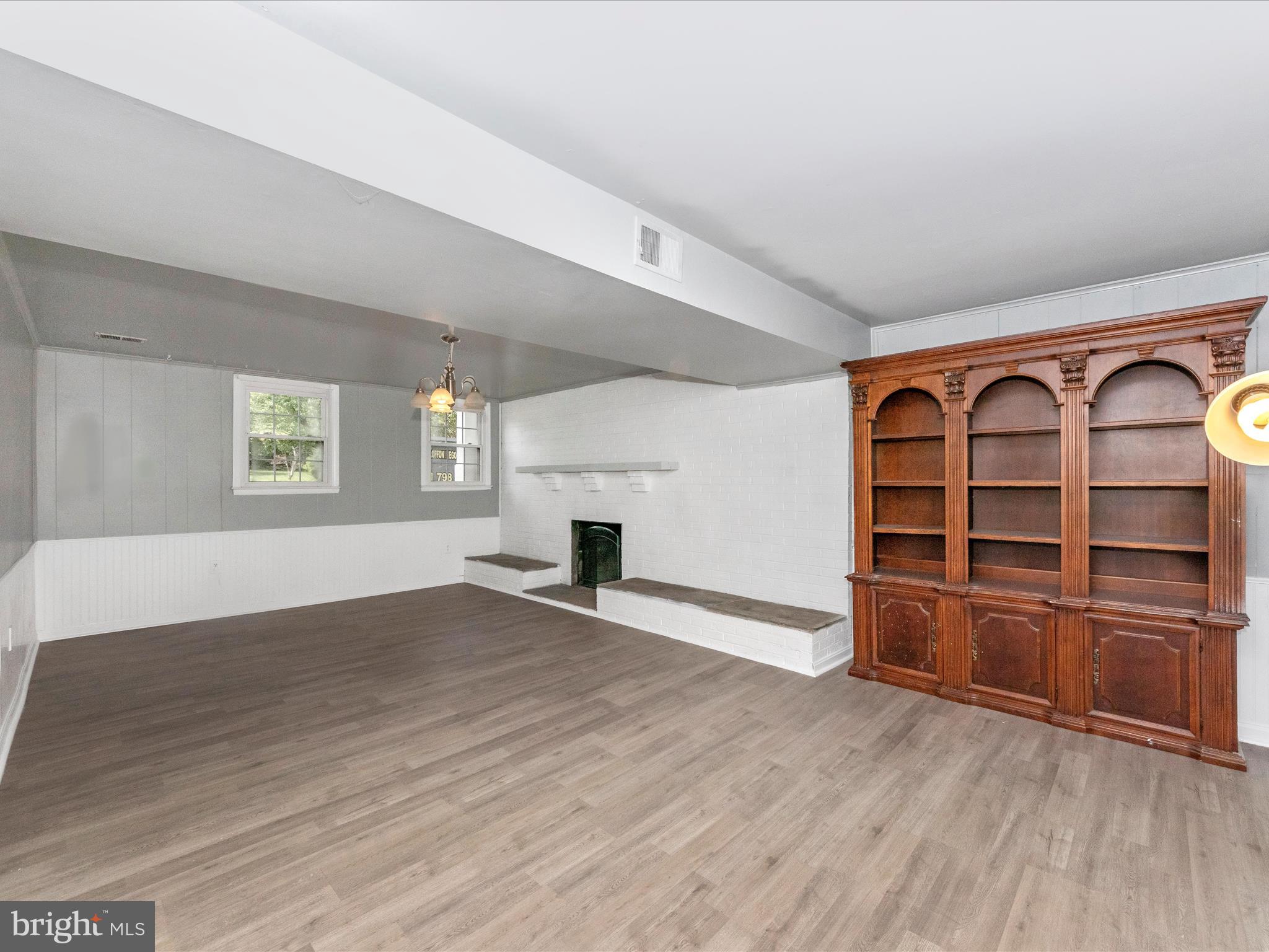 6503 Walker Branch Drive Laurel, MD 20707 - Photo 25 of 36 an empty room with wooden floor closet and windows