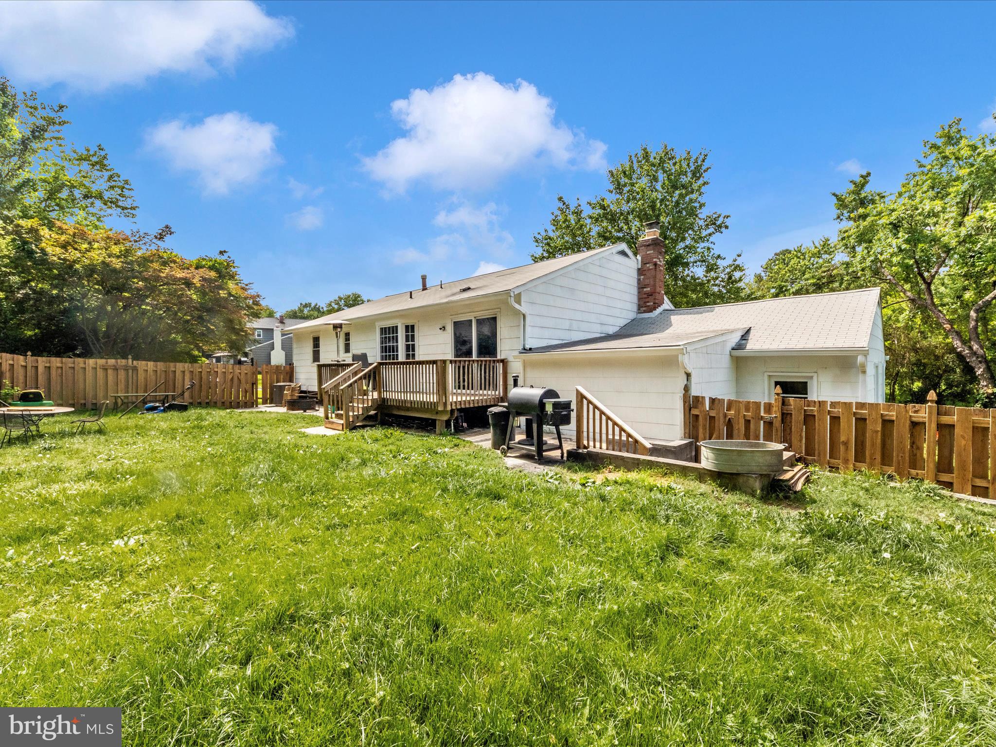 6503 Walker Branch Drive Laurel, MD 20707 - Photo 34 of 36 a view of a house with backyard and sitting area