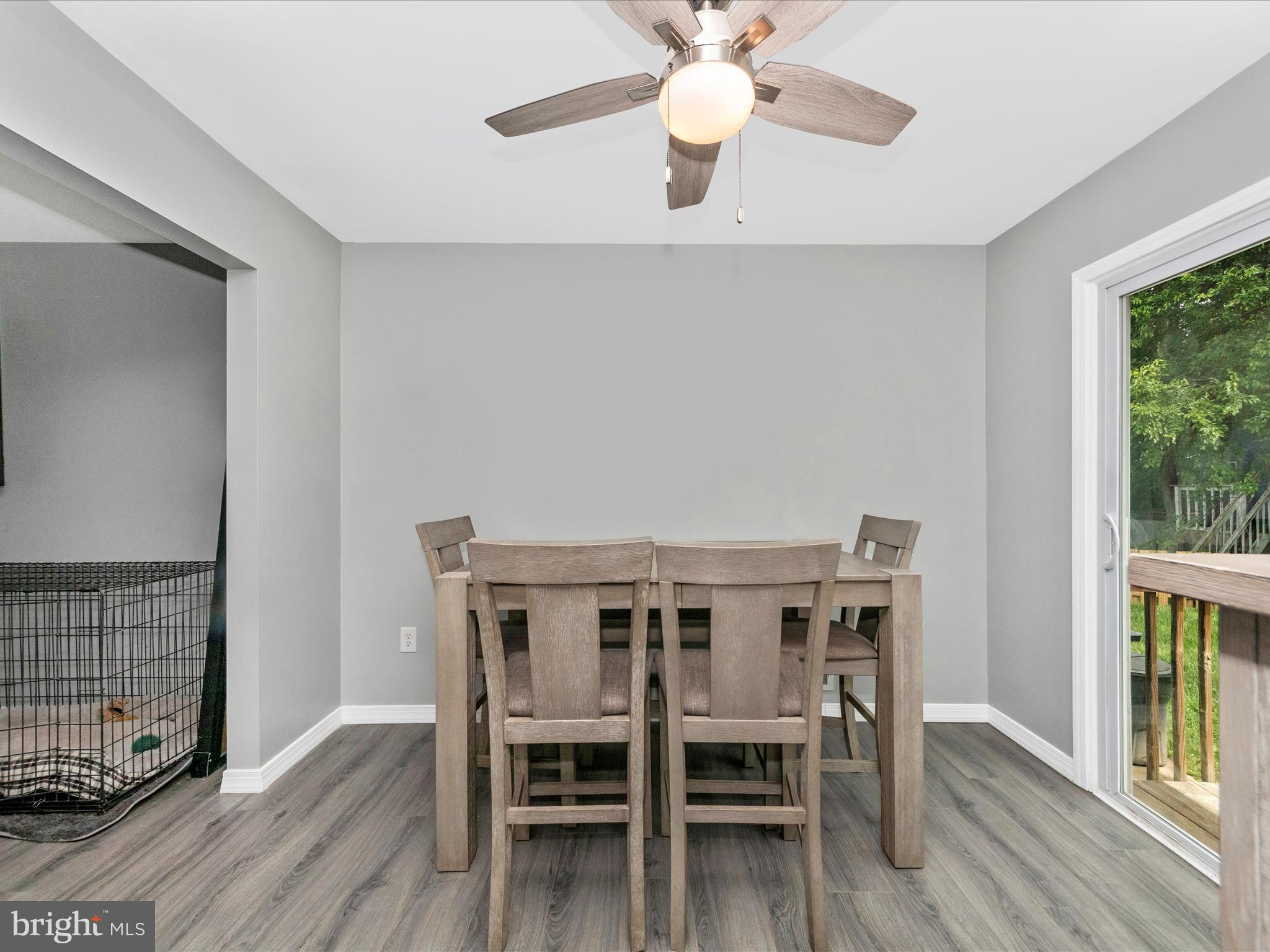6503 Walker Branch Drive Laurel, MD 20707 - Photo 8 of 36 a view of a dining room with furniture and wooden floor