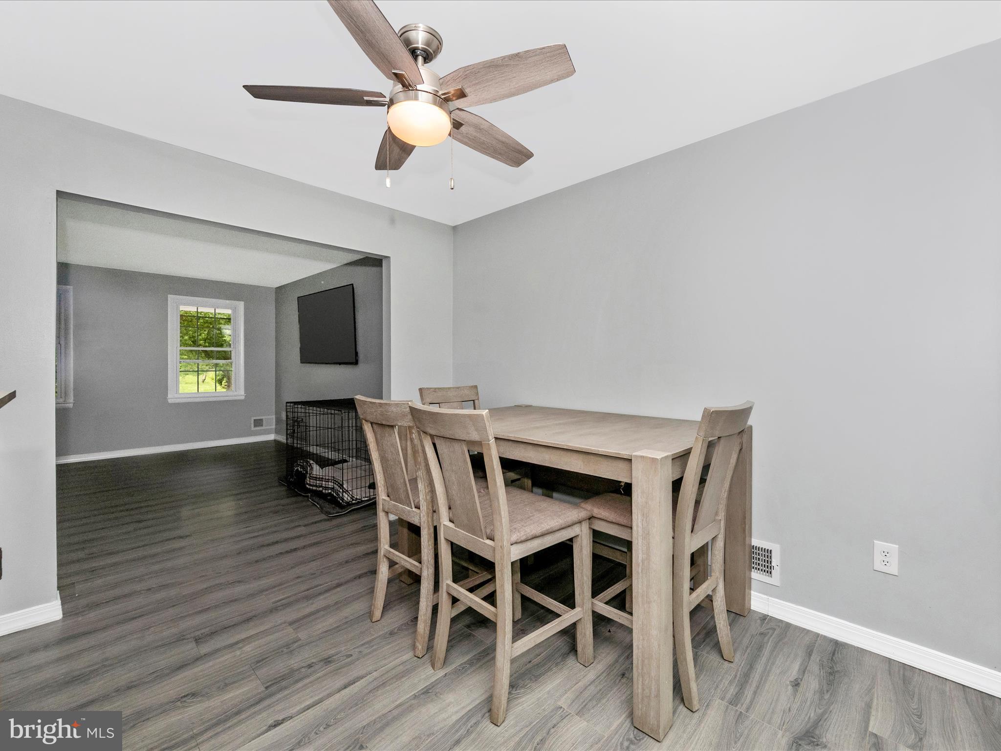 6503 Walker Branch Drive Laurel, MD 20707 - Photo 9 of 36 a view of a dining room with furniture window and wooden floor