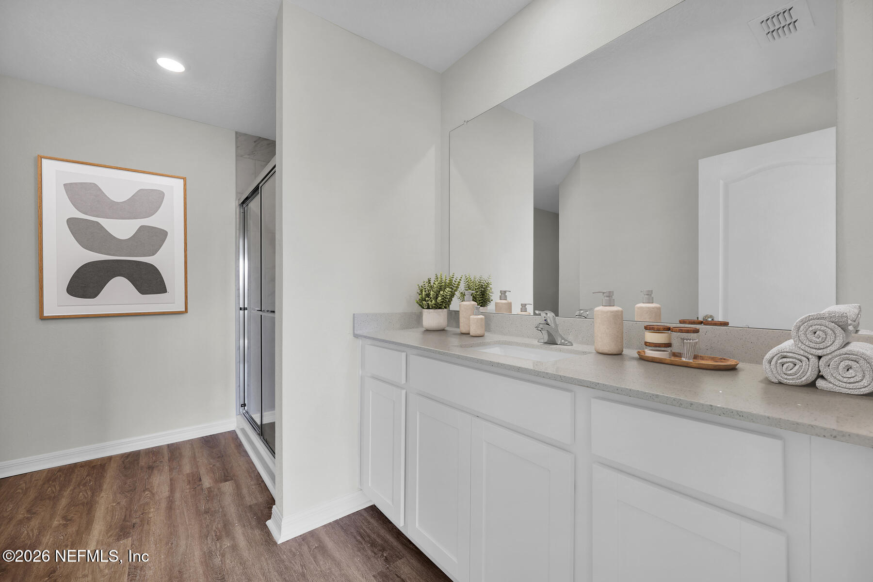 37397 Whisper Way Hilliard, FL 32046 - Photo 7 of 14 a bathroom with a sink and a mirror