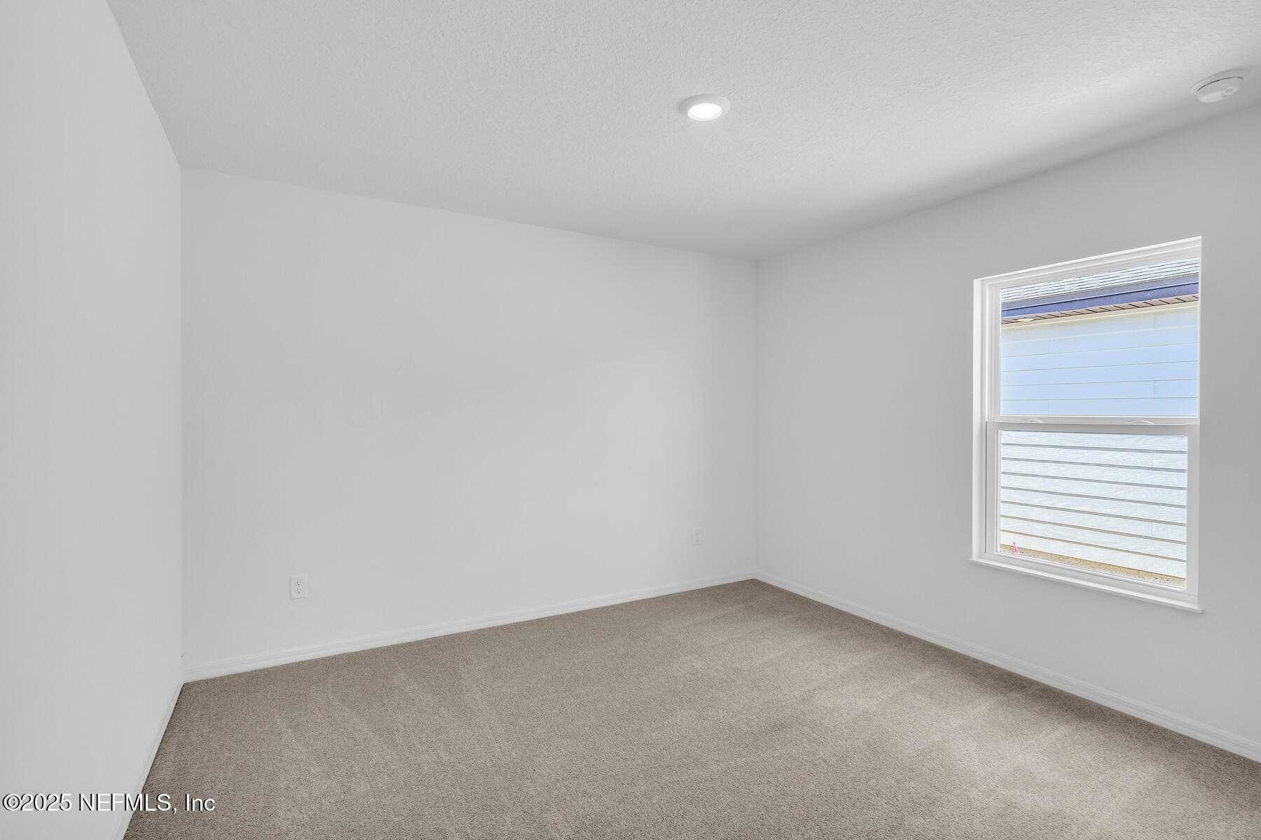 37397 Whisper Way Hilliard, FL 32046 - Photo 9 of 14 an empty room with a window