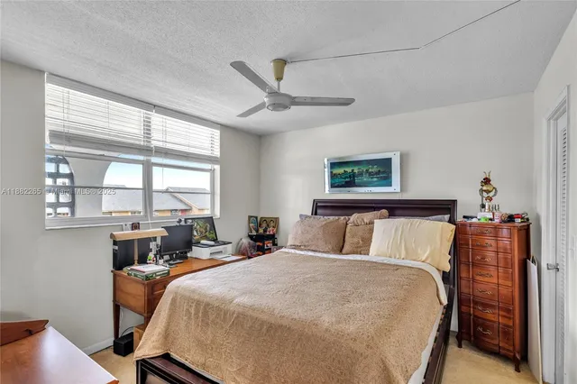 a bed room with a bed and a window