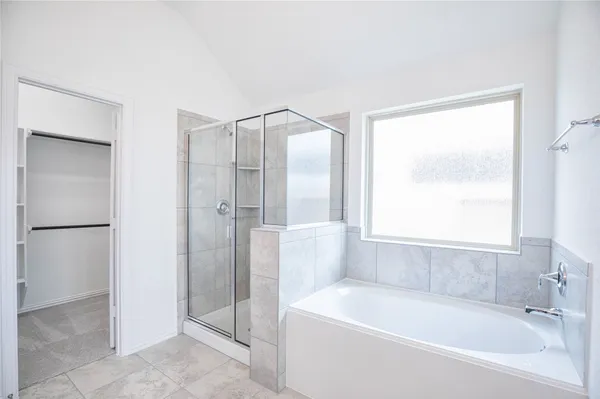 a white bath tub sitting next to a window
