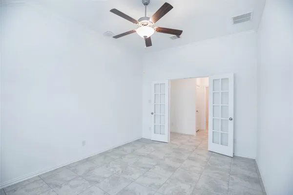 a view of a hallway with wooden floor and closet