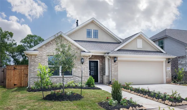 a front view of a house with garage