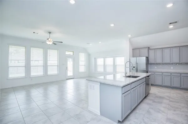 a kitchen with a sink and cabinets