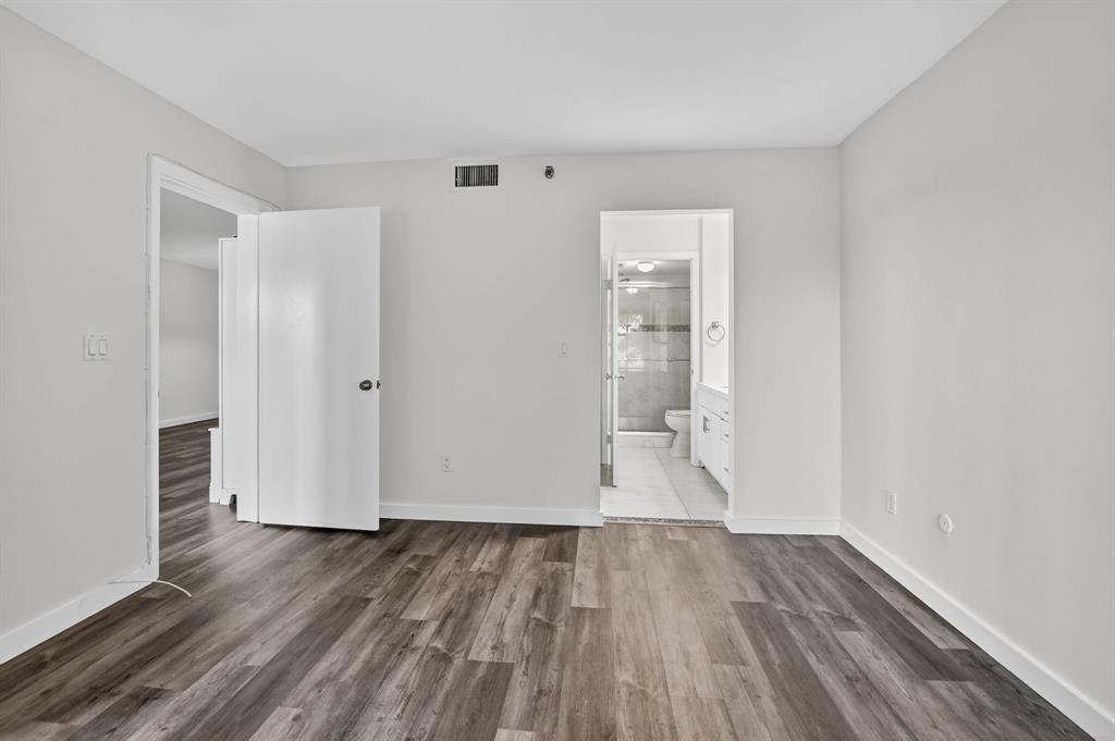 260 Northwest 67th Street, Unit A104 Boca Raton, FL 33487 - Photo 16 of 43 a view of empty room with wooden floor