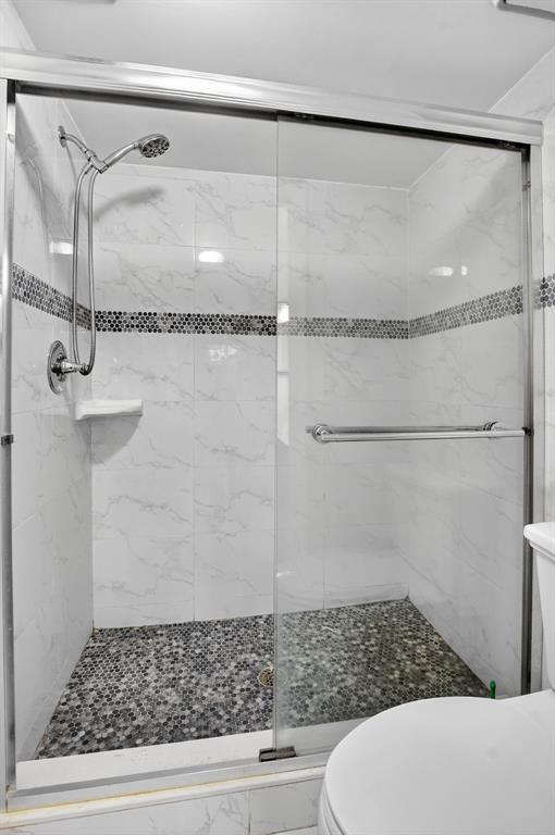 260 Northwest 67th Street, Unit A104 Boca Raton, FL 33487 - Photo 19 of 43 a bathroom with a shower