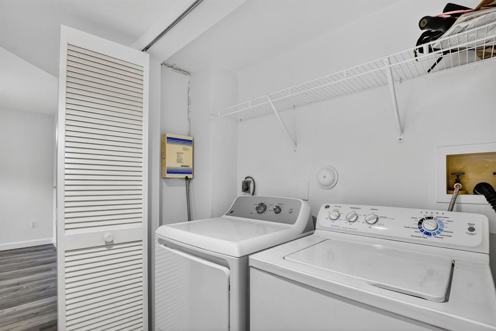 260 Northwest 67th Street, Unit A104 Boca Raton, FL 33487 - Photo 25 of 43 a utility room with dryer and washer