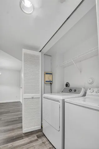 a living room with couch and a floor to ceiling window