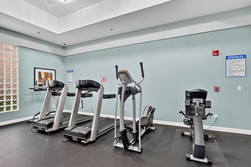 260 Northwest 67th Street, Unit A104 Boca Raton, FL 33487 - Photo 33 of 43 a view of a room with gym equipment
