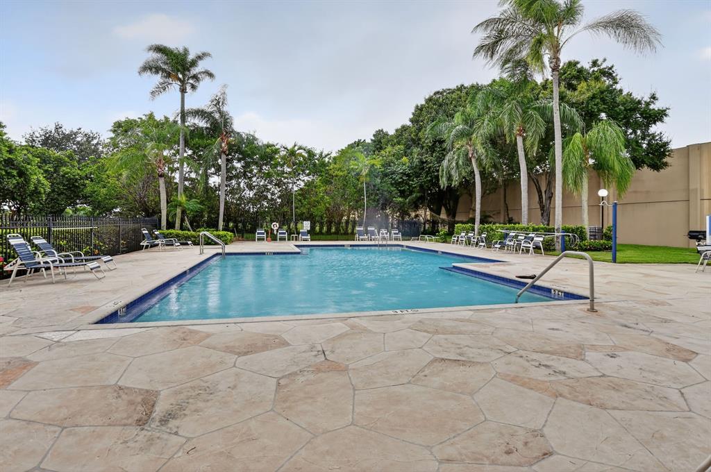 260 Northwest 67th Street, Unit A104 Boca Raton, FL 33487 - Photo 38 of 43 a view of outdoor space with trees