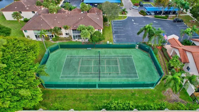 an aerial view of house with swimming pool outdoor seating and yard