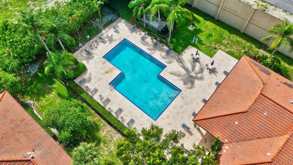 260 Northwest 67th Street, Unit A104 Boca Raton, FL 33487 - Photo 41 of 43 a view of a yard with an outdoor space