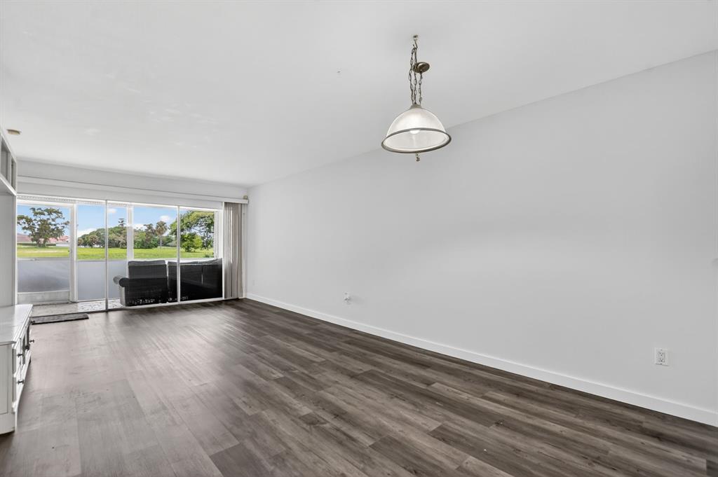 260 Northwest 67th Street, Unit A104 Boca Raton, FL 33487 - Photo 8 of 43 a view of an empty room with a window