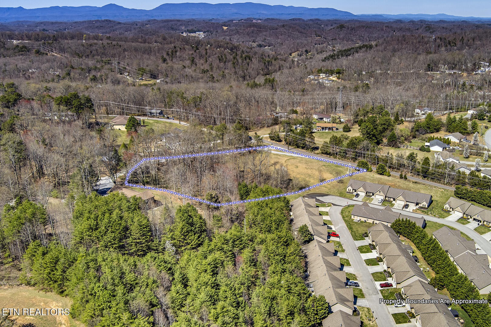 an aerial view of residential house with an outdoor space