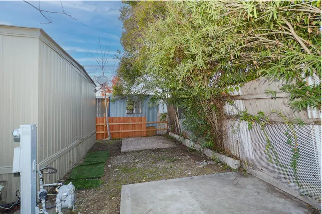 a backyard of a house with lots of green space