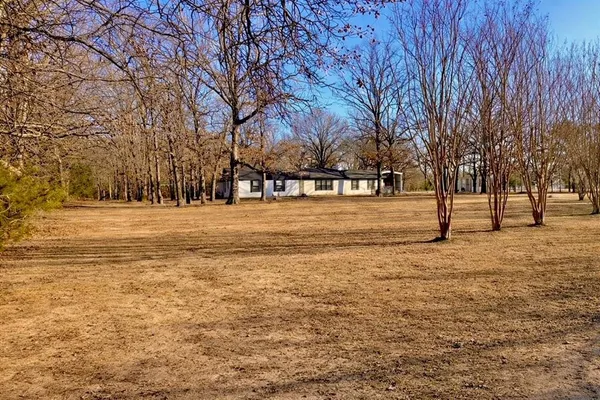 a view of road with trees