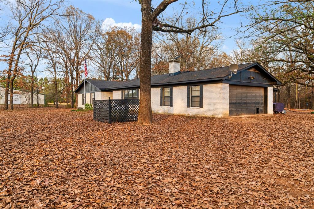 333 County Road Powderly, TX 75473 - Photo 5 of 15 a front view of a house with a yard